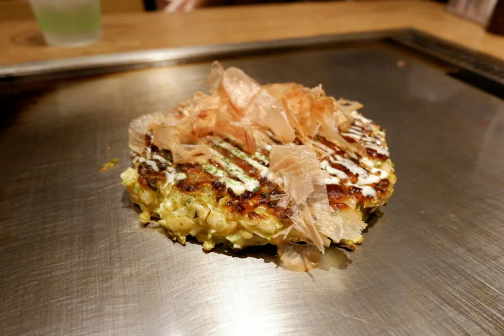 Okonomiyaki is a famous food in Osaka